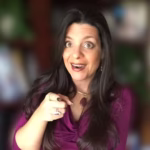 Stephanie Calahan Business Vision Catalyst and Danny Havanese Dog Stephanie LH Calahan Transformational Business Vision Catalyst pointing finger