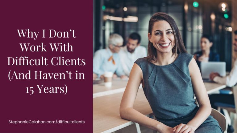 Why I Don’t Work With Difficult Clients (And Haven’t in 15 Years) Confident professional woman leaning on a conference desk smiling into the camera while other professionals are talking in the background.